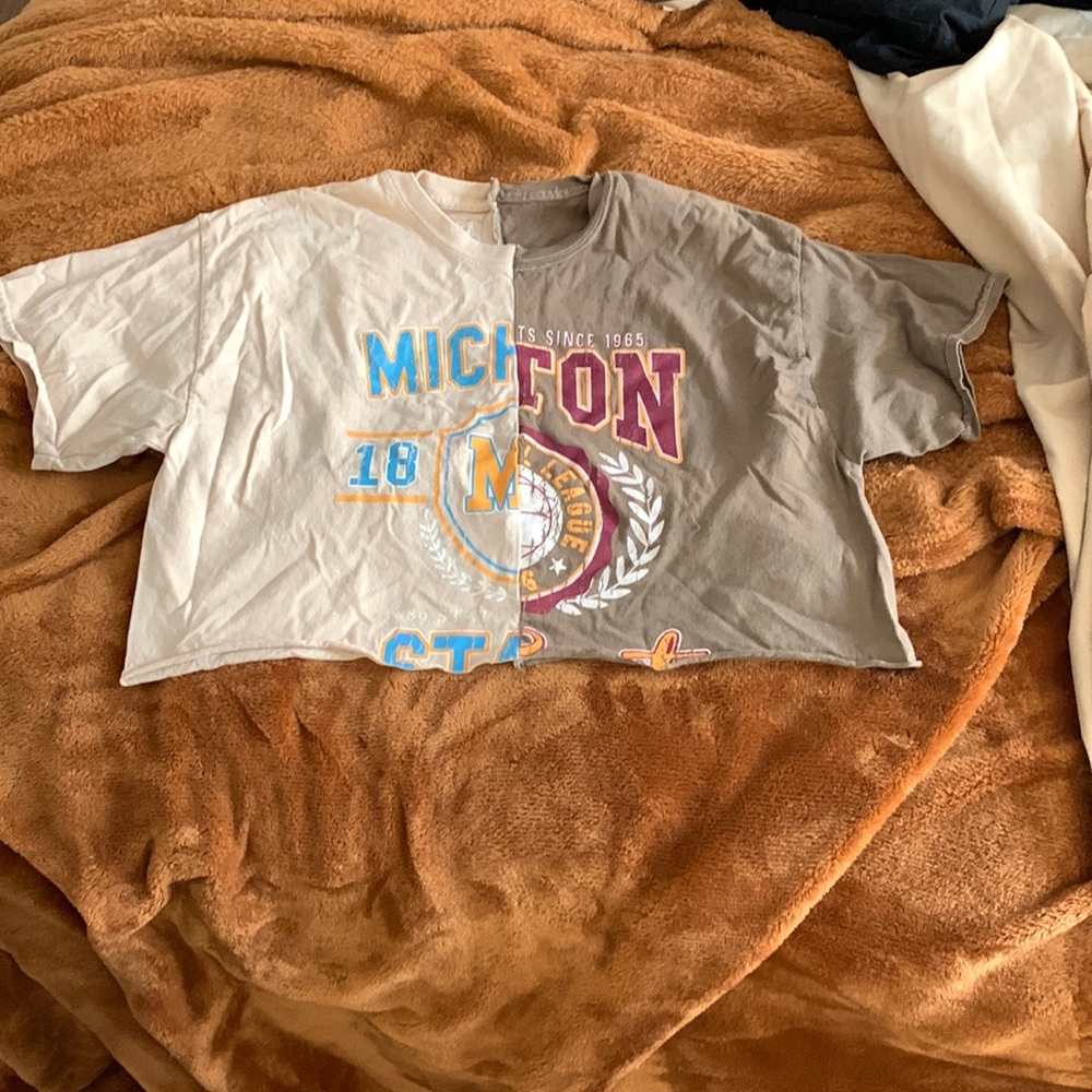Cropped half split shirt, fits loose but very cute